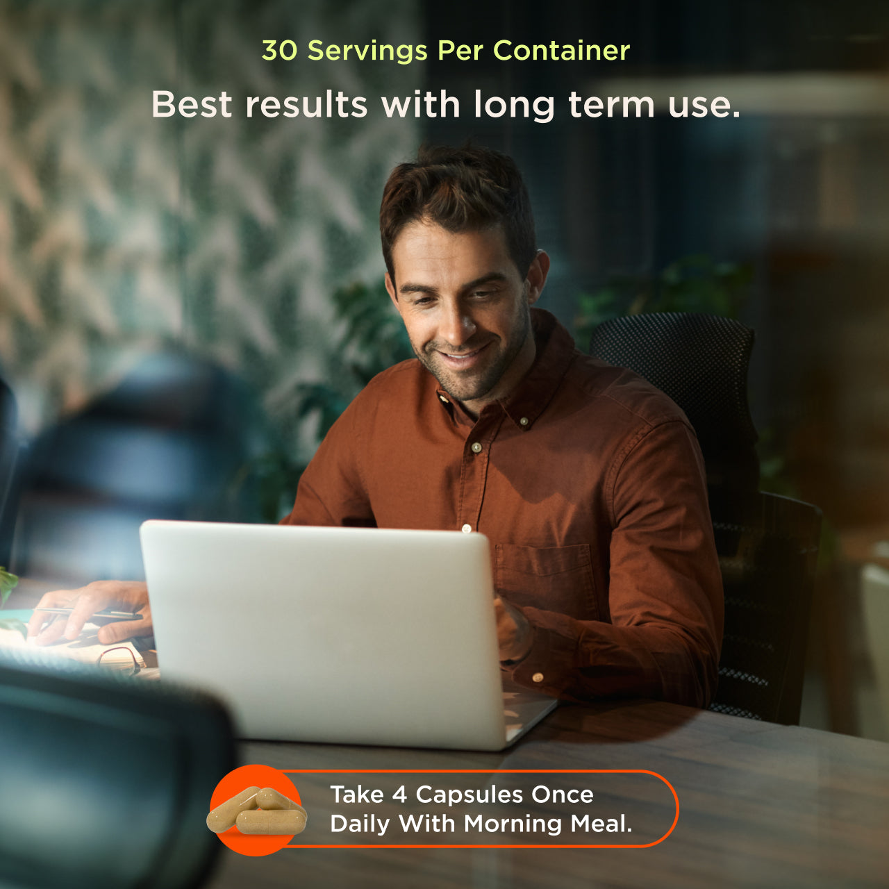 Man using a laptop with text about capsules and servings per container.